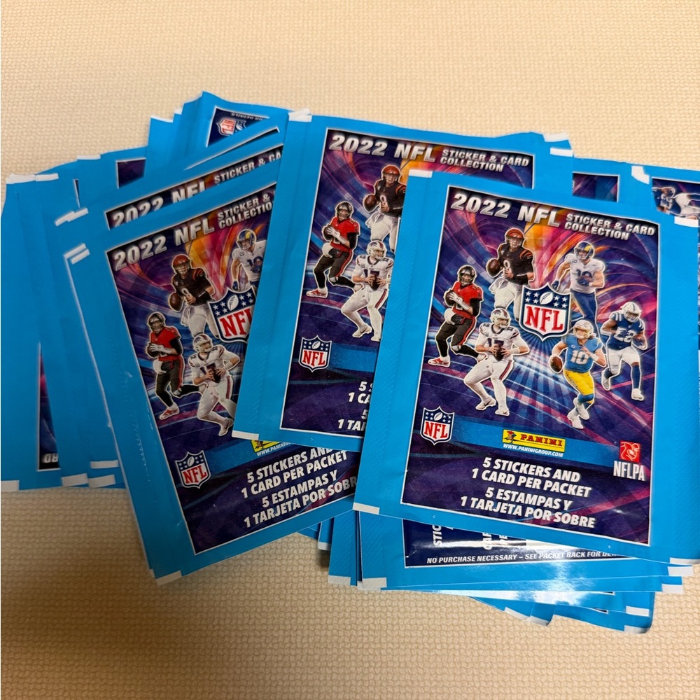 NFL 2022 Panini sticker & card packs for collector book-31 packs total unopened